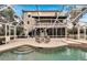 Spacious pool and deck area with screened enclosure at 1406 Butch Cassidy Trl, Wimauma, FL 33598