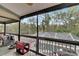 Spacious screened porch overlooking the pool and lush landscape at 1406 Butch Cassidy Trl, Wimauma, FL 33598