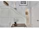 Elegant staircase with white wainscoting at 1406 Butch Cassidy Trl, Wimauma, FL 33598