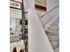 Elegant staircase with white wainscoting at 1406 Butch Cassidy Trl, Wimauma, FL 33598