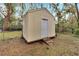 Convenient storage shed with a ramp for easy access at 1406 Butch Cassidy Trl, Wimauma, FL 33598