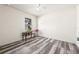 Simple bedroom with gray wood-look flooring at 14443 Wake Robin Dr, Brooksville, FL 34604