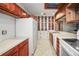 Bright kitchen with white appliances and wood cabinets at 1526 Oakwood St, Clearwater, FL 33755