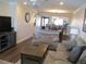 Open living area showcasing hardwood floors and a view to dining area at 19029 Us Highway 19 N # 33A, Clearwater, FL 33764