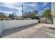 Fenced backyard with gravel and wooden deck at 1918 Overbrook Ave, Clearwater, FL 33755