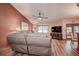 Cozy living room with vaulted ceilings, a ceiling fan, and wood-look flooring at 2512 Southern Oak Cir, Clearwater, FL 33764