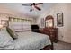 Comfortable Primary bedroom with a ceiling fan, and plush carpeting at 2512 Southern Oak Cir, Clearwater, FL 33764