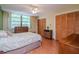Bright bedroom featuring two closets, a ceiling fan, and light wood flooring at 2612 Pearce Dr # 304, Clearwater, FL 33764