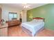 Bedroom with ceiling fan, wood flooring, and ensuite bathroom at 2612 Pearce Dr # 304, Clearwater, FL 33764