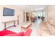 Spacious living room with a large sectional sofa and view into dining area at 2612 Pearce Dr # 304, Clearwater, FL 33764