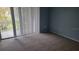 Bedroom with carpet, sliding door to balcony at 2625 State Road 590 # 622, Clearwater, FL 33759