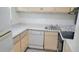 Small condo kitchen with light cabinets and appliances at 2625 State Road 590 # 622, Clearwater, FL 33759