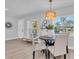 Charming dining area with stylish light fixture at 420 Madison S St, St Petersburg, FL 33711