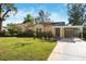 Charming single-story home with carport and well-manicured lawn at 4726 29Th S Ave, Gulfport, FL 33711