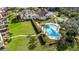 Complex with pool and lush landscaping near water at 504 S Florida Ave # 212, Tarpon Springs, FL 34689