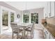 Cozy breakfast nook with bright windows, stylish chandelier and easy access to outdoor patio at 5212 Candler View Dr, Lithia, FL 33547