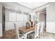 Dining room featuring a stylish chandelier, decorative wall panels, and a modern table setting for elegant dinners at 5212 Candler View Dr, Lithia, FL 33547