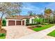 Beautiful one-story home with tile roof, paver driveway, and lush landscaping at 5212 Candler View Dr, Lithia, FL 33547