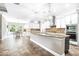 Bright, open kitchen features a large island, stainless steel appliances, and elegant pendant lighting at 5212 Candler View Dr, Lithia, FL 33547
