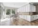 Kitchen and breakfast nook area with large windows and stylish pendant lighting at 5212 Candler View Dr, Lithia, FL 33547