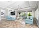 Spacious living room with built-in shelving, a tray ceiling, and large windows at 5212 Candler View Dr, Lithia, FL 33547