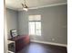 This is an office with a desk, a chair, a window, and a ceiling fan at 5212 Candler View Dr, Lithia, FL 33547