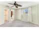 Large bedroom with carpeting, ceiling fan, and ensuite bathroom at 6338 Newtown Cir # 38A6, Tampa, FL 33615