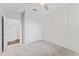 Spacious bedroom with white paneled accent wall, carpet, and ceiling fan at 6421 Mooring Line Cir, Apollo Beach, FL 33572