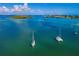 Aerial view of boats in the bay near waterfront homes at 744 Jungle Queen Way, Longboat Key, FL 34228