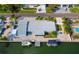 Aerial view of waterfront home with private dock and boat slips at 744 Jungle Queen Way, Longboat Key, FL 34228