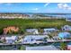 Aerial view of waterfront home with private dock at 744 Jungle Queen Way, Longboat Key, FL 34228