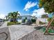 Private backyard patio with fire pit at 744 Jungle Queen Way, Longboat Key, FL 34228