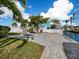 Landscaped backyard with canal views at 744 Jungle Queen Way, Longboat Key, FL 34228