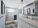 Updated bathroom with a large vanity and shower at 744 Jungle Queen Way, Longboat Key, FL 34228