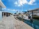Private boat dock with paved walkway at 744 Jungle Queen Way, Longboat Key, FL 34228