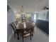 Dining room showcasing wooden table and chairs with a view into the kitchen and living area at 744 Jungle Queen Way, Longboat Key, FL 34228
