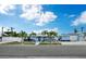 House exterior with landscaping and driveway at 744 Jungle Queen Way, Longboat Key, FL 34228