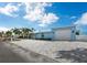 House exterior with attached garage at 744 Jungle Queen Way, Longboat Key, FL 34228