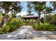 Picturesque gazebo nestled amongst lush greenery at 744 Jungle Queen Way, Longboat Key, FL 34228