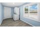 Laundry room with washer and dryer, light blue walls at 744 Jungle Queen Way, Longboat Key, FL 34228