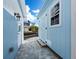 Light blue shed and brick patio at 744 Jungle Queen Way, Longboat Key, FL 34228
