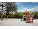 playground with swings and play structures at 744 Jungle Queen Way, Longboat Key, FL 34228