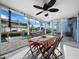 Enjoy water views from this screened porch at 744 Jungle Queen Way, Longboat Key, FL 34228