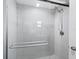 Clean shower with glass enclosure and pebble floor at 744 Jungle Queen Way, Longboat Key, FL 34228
