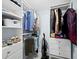 Large walk-in closet with plenty of shelving and hanging space at 744 Jungle Queen Way, Longboat Key, FL 34228