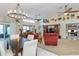 Bright dining area with a table and chairs, open to the living room at 8049 Hutchinson Dr, New Port Richey, FL 34653