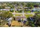 Birds-eye view of a house with a fenced backyard and surrounding properties at 9890 54Th N St, Pinellas Park, FL 33782