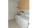 Laundry room with washer, dryer, and cabinets at 11347 Hollander Ave, Hudson, FL 34667