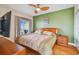 Bedroom with wooden furniture and beach-themed decor at 11605 Gulf Blvd # 501, Treasure Island, FL 33706