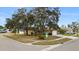 Single-story home situated on a corner lot with mature trees and landscaping at 11902 Snapdragon Rd, Tampa, FL 33635